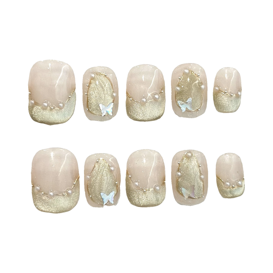 Nude Pink Cat Eye press-on nail set, 10 nail tips on a white background